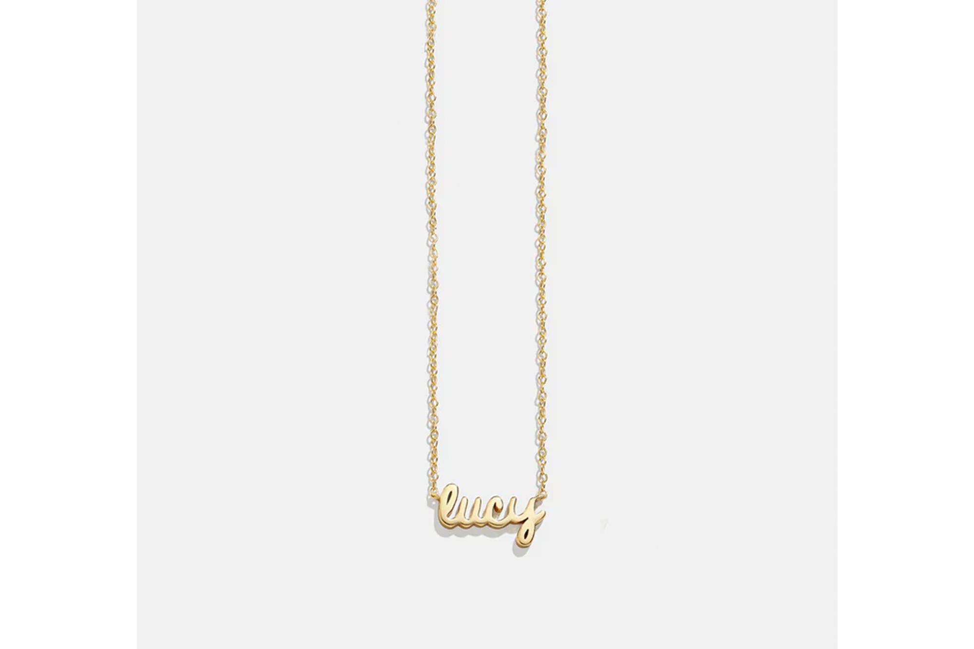 A nameplate necklace that says "Lucy" 
