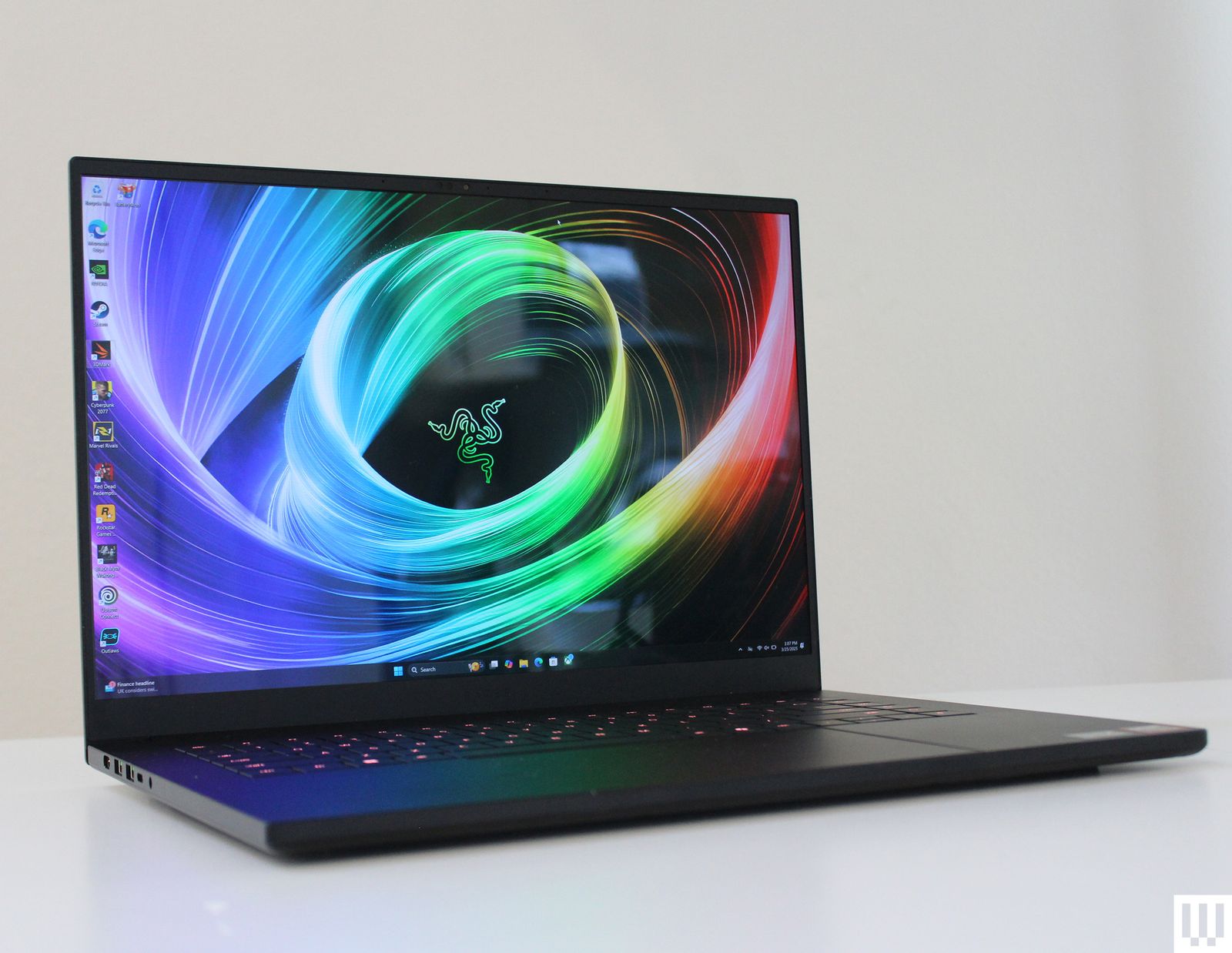 Front view of Razer Blade 16 2025 edition a slim black laptop with abstract art on the screen