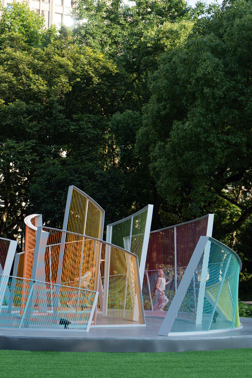 overlapping nylon ropes shape colorful curved contours for mirage installation in shanghai